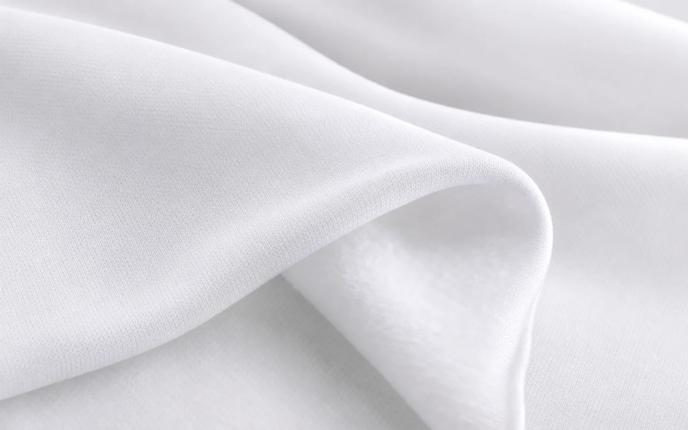 Detalle de tela Gimnastic blanca con exterior liso e interior afelpado
