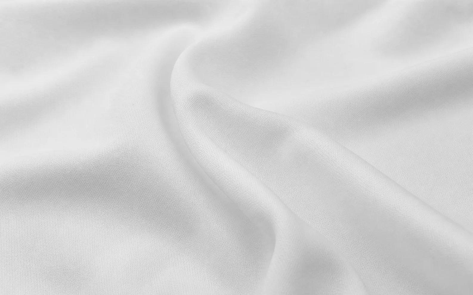 Detalle de tela Shelsey blanca de superficie lisa y cerrada
